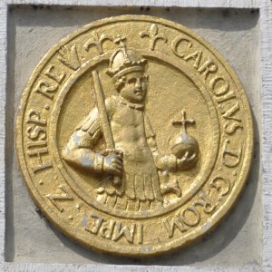 Gable stone in Amsterdam, showing a coin of Charles V.